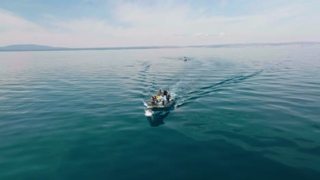 A-Tour-Boat-With-People-On-board-Sailing-Near-The-Lošinj-Island-In-Croatia-For-Dolphin-Watching-Activity