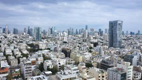 Tel-Aviv,-Israel-skyline-featuring-key-buildings-and-urban-density-on-a-sunny-day-with-blue-sky-and-light-cloud