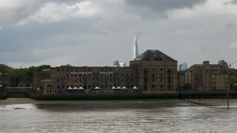 Columbia-Wharf-Building-Viewed-From-Across-The-Thames-River-On-Cloudy-Day-Locked-Off