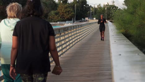 A-railway-bridge-for-walkers-to-cross-over-to-the-other-side-of-the-trail,-and-to-look-at-the-boats-and-over-the-horizon