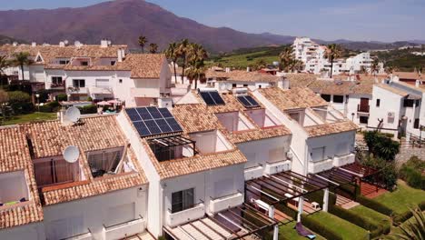 Aerial-View-Of-Holiday-Villas-With-Solar-Panels-On-Roof