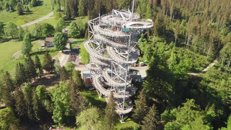 Aerial-shot-of-an-observation-tower---sky-walk-over-the-clouds-in-Sudety-mountains
