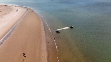 An-aerial-view-of-the-beach-at-Gravesend-Bay-in-Brooklyn,-NY-as-two-jet-ski-riders-prepare-to-ride