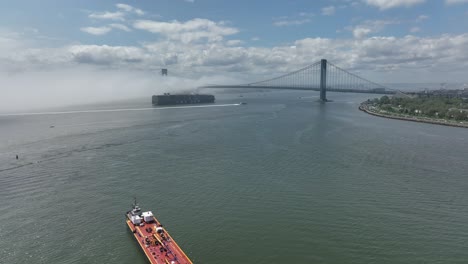 An-aerial-view-of-Gravesend-Bay-in-Brooklyn,-NY-on-a-cloudy-day-with-dense-fog-over-the-water
