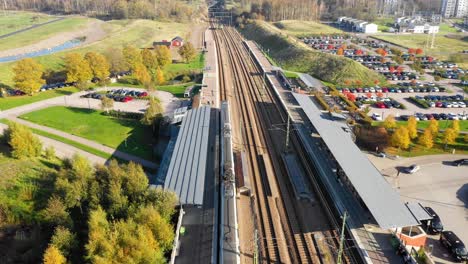Aerial-view-of-train-station-with-train-arriving