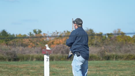 At-a-shooting-range,-a-man-aiming-with-a-long-rifle