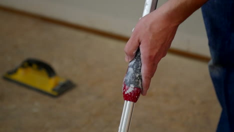 Person-Rolls-Paint-Onto-Paint-Roller-In-Slow-Motion