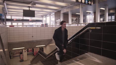 Confident-Young-Mixed-Race-Man-Runs-Up-Stairs-in-Subway-Station