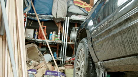 Man-With-Air-Compressor-Checking-Tire-in-Garage-PUSH-IN