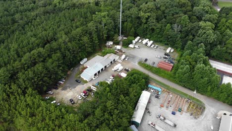 Aerial-tracking-of-an-auto-shop-scrap-yard-in-the-forest