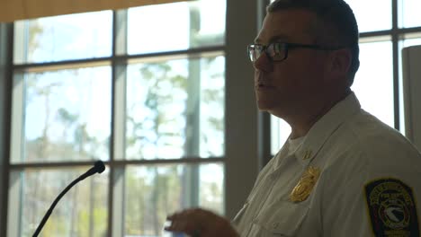 Firefighter-captain-talks-during-a-morning-briefing-at-a-fire-department