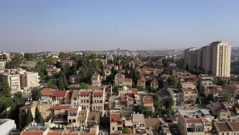 Israel,-Jerusalem-beautiful-neighborhood-rooftops-view,-forward-fly-over,-aerial-shot
