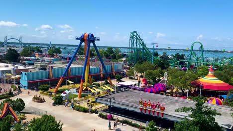Cedar-point-amusement-park-aerial-view-including-the-maxAir-ride,-roller-coasters-and-sky-ride,-sunny-day-in-summer-at-Sandusky,-ohio,-United-states