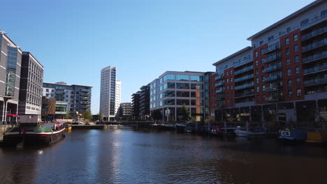 Time-Lapse-of-Leeds-Dock-in-Yorkshire,-UK-with-Yellow-Water-Taxi-Arriving---Departing-on-a-Sunny-Summer’s-Day-with-Blue-Sky