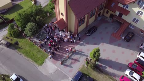 Aerial-shot-of-a-wedding-ceremony-in-a-small-church-on-a-coutryside