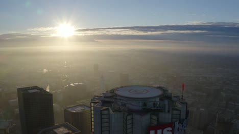 Beautiful-aerial-fly-over-US-Bank-helipad-during-sunrise