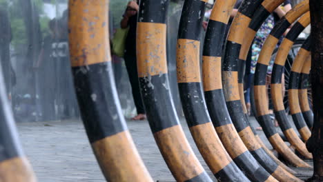 Abstract-foreground-with-curved-installations-for-bicycles-to-lock-them-down-on-the-streets-people-walking-on-the-streets