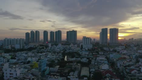 Dramatic-Truck-Drone-Sunset-shot-over-high-density-residential-area-of-Saigon,-Ho-Chi-Minh-City,-Vietnam