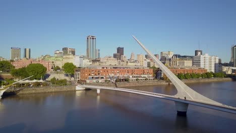 Aerial-of-Puente-de-la-Mujer,-warehouses-and-Puerto-Madero-buildings