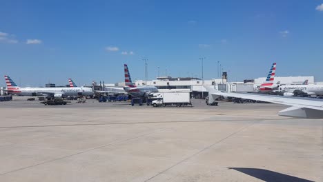 View-out-of-airplane-window-while-driving-to-airport-gate,-Dallas-Texas