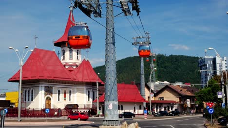 Locked-shot-of-the-Descent-of-the-Holy-Spirit-church-and-cable-car-at-Piatra-Neamt,-Romania