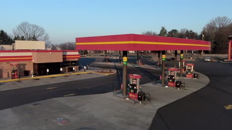 Aerial-view-of-gas-station-and-convenience-store-in-a-suburban-area-of-a-small-town-in-Pennsylvania,-Rutter's-gas-station-and-store-in-Lancaster,-truck-stop-refueling
