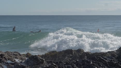 Surfers-Paddling-Over-The-Ocean-Waves---Greenmount-Beach-Perfect-For-Surfing-And-Summer-Vacation---Coolangatta,-Gold-Coast,-Australia