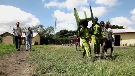 School-children-and-American-missionaries-walk-in-the-yard-of-a-private-school-outside-of-Nairobi