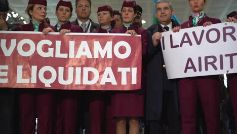 Air-Italy-workers-in-uniform-with-banners-protesting