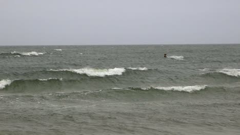 Two-men-kite-surfing-during-winter-on-Baltic-sea