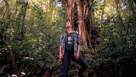 Slow-Motion-of-Young-Woman-Spotting-Wild-Tropical-Animals-in-the-jungle-in-Tambor,-Costa-Rica