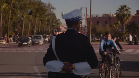 Moroccan-police-officer-standing-guard-on-busy-intersection