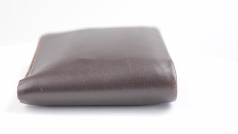 Close-up-of-the-rotation-Beautiful-male-Brown-leather-wallet
