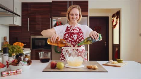 Mixing-a-delicious-fruit-punch-in-the-kitchen--wide