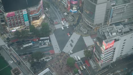 Wide-High-Angle-Top-Down-Shot-of-Traffics-at-the-Shiubya-Crossing,-Slow-Motion