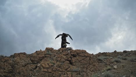 Golden-eagle-nomadic-hunter-with-bird-on-Altai-Mountains,-Bayan-Olgii,-Mongolia