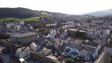 Aerial-view-of-pretty-white-cottages-on-the-seafront-of-Conwy-town,-Wales