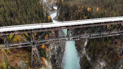 Aerial-View,-Road-Bridge-Above-Deep-Canyon-and-River-in-Landscape-of-Alaska-USA