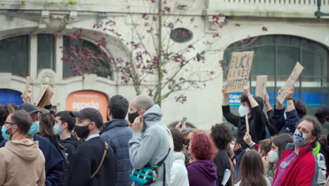 Porto-Portugal---june-6th-2020:-BLM-Black-Lives-Matter-Protests-Demonstration-with-protesters-holding-black-lives-matter-signs-in-the-air