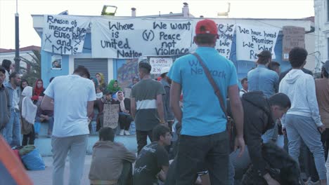 Refugees-protest-in-Sappho-Square,-Mytilene-following-death-of-Afghan-man,-Medium-Wide-Shot