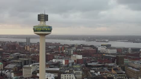 Aerial-view-iconic-Liverpool-landmark-radio-city-tower-empty-city-skyline-during-coronavirus-pandemic-descending-shot