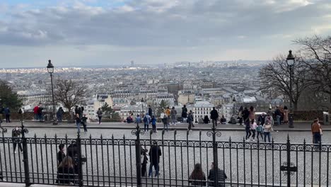 Panorama-of-Paris-from-montmatre-with-masked-crowd-of-tourists-in-Paris,-France