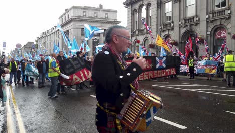 A-banner-criticizing-Scottish-Conservative-MP,-Ross-Thomson-during-a-Scottish-Independence-march-in-the-city-of-Aberdeen