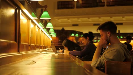 State-Library-Victoria-at-nighttime-people-studying-at-melbourne-library-Melbourne-tourism-attractions,-melbourne-library