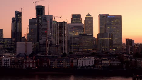 Aerial-view-of-London-Business-financial-district,-Canary-Wharf,-Isle-of-Dogs,-Canada-Square-with-an-awesome-sunset