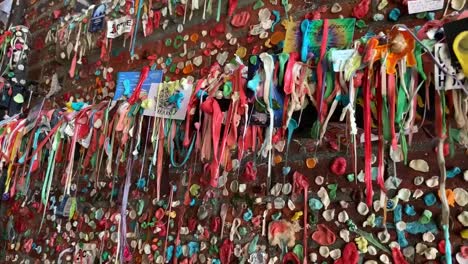 Colorful-bubble-gum-strands-draping-over-a-pipeline-that-runs-under-Pike's-Market-in-Post-Alley-Way