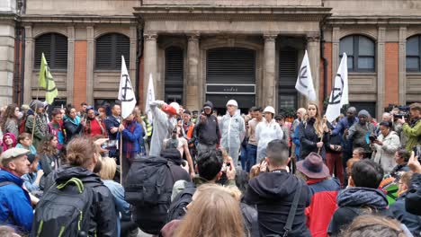 Peaceful-protest-pouring-black-liquid-trough-volunteers-throat