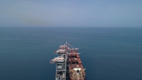 Aerial-footage-of-a-Large-Bulk-carrier-offloading-coal-for-a-large-scale-power-plant