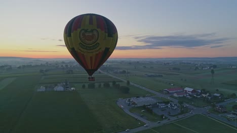 Aerial-View-of-Hot-Air-Balloons-Filling-Up-and-Taking-Off-at-a-Hot-Air-Balloon-Festival-on-a-Summer-Morning