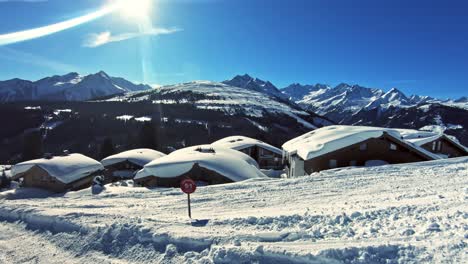 Panoramic-view-of-huts-roof-covered-with-snow
